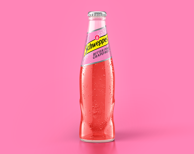Schweppes Bitter Pink Grapefruit als 0,2 Liter Flasche vor pinkem Hintergrund
